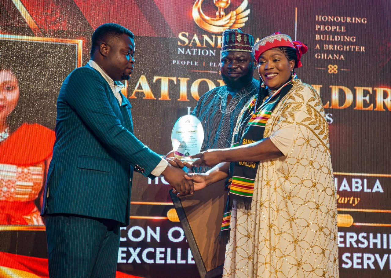 Janet Nabla receiving the Sankofa Pan-African Icon Award on stage at the Nation Builders Convocation