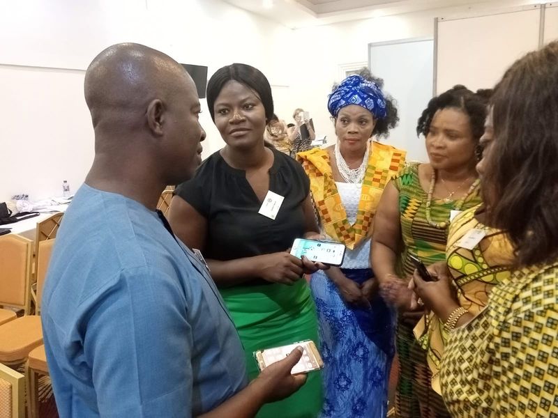 Participants chatting at a meeting