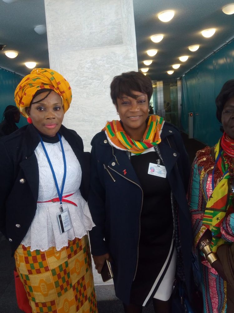Women posing together at an international venue