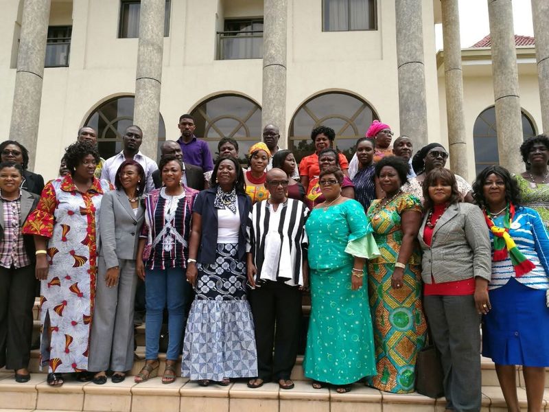 A large group photo on the steps of a building